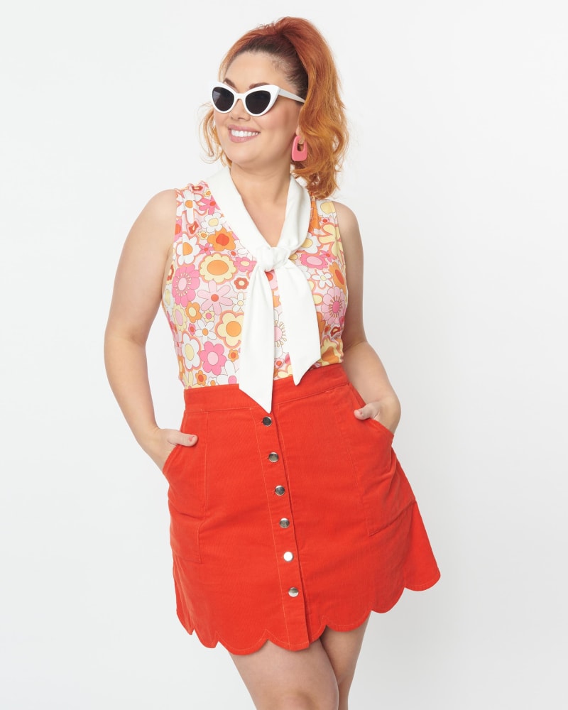 Front of a model wearing a size 4X Smak Parlour Burnt Orange Campus Mini Skirt in Orange by Smak Parlour. | dia_product_style_image_id:298616